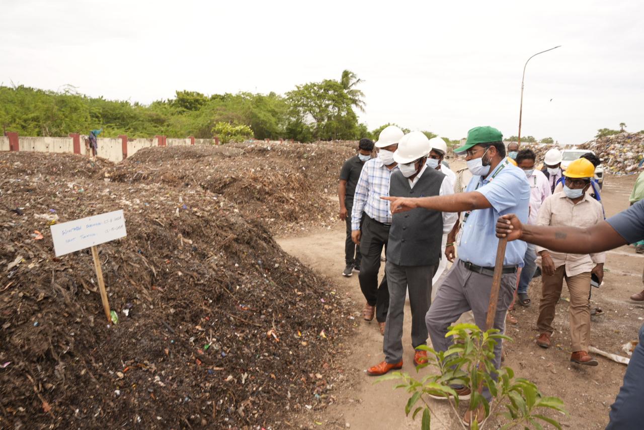 Officials inspecting legacy waste windrows at remediation site